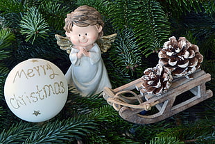 Angel and brown sled figurines