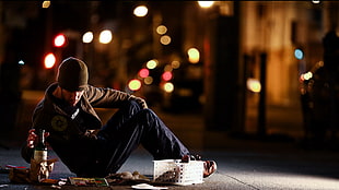 homeless man with bokeh light background