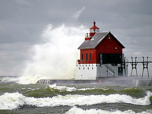 big waves hitting lighthouse