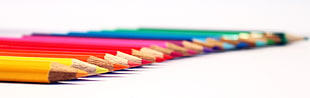 macro photography of color pencil set