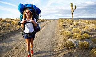 woman wearing white shirt carrying blue hiking bag HD wallpaper