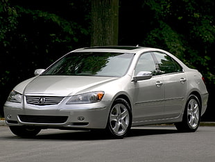 silver Acura sedan on concrete road during daytime