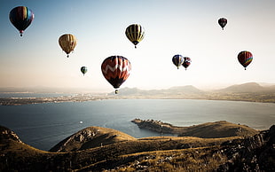 hot air balloon, hot air balloons, water, landscape, coast HD wallpaper