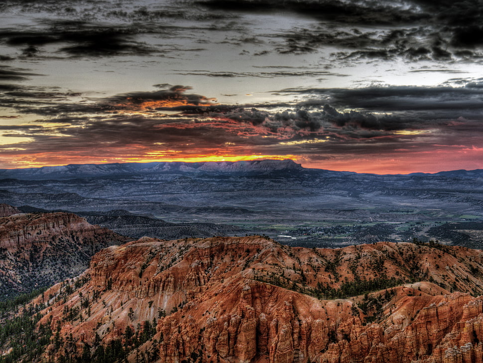 rock hills under cloudy sky photo HD wallpaper