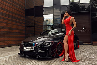 women's red halter thigh slit dress; black BMW M3 coupe, women, tanned, red dress, car