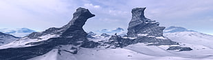 landscape photo of rock formation coated by snow ice