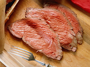 raw meat on brown wooden surface