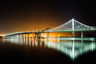 white bridge light during nightime