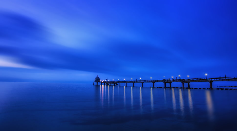dock near body of water during night time HD wallpaper