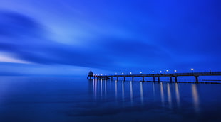 dock near body of water during night time