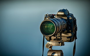 shallow focus photography of Nikon DSLR camera
