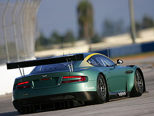 green Aston Martin sports car HD wallpaper