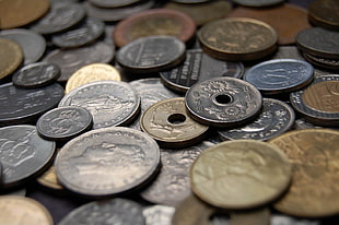 round silver-colored and brass-colored coin collection