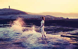 woman in white dress beside body of water HD wallpaper