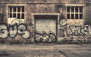 gray bricked building with graffiti