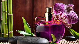 purple labeled fragrance bottle landscape photography