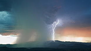 photography of lightning during golden hour
