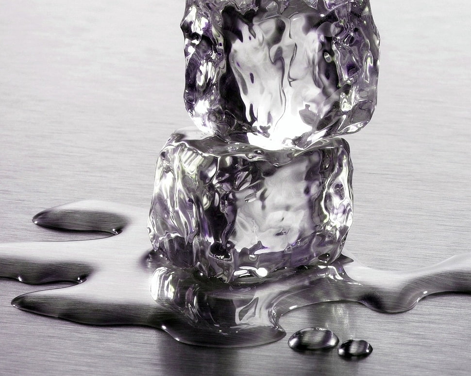 two melted ice cubes on gray surface HD wallpaper