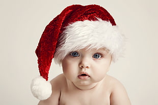 baby wearing santa hat
