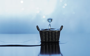 wicker basket with water dew in closeup photography