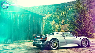 silver sports car beside wooden barn HD wallpaper