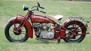 red Indian motorcycle on grass field