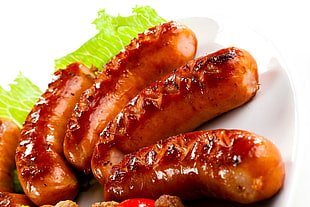 grilled sausages on white ceramic plate HD wallpaper
