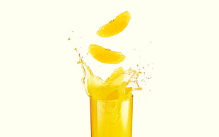 yellow liquid in clear drinking glassw HD wallpaper