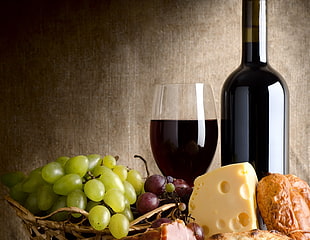 wine bottle with grapes, cheese and bread wallpaper