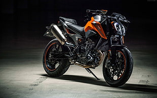 black and orange cruiser motorcycle