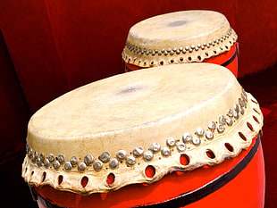red and white wooden drum