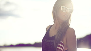 woman in black tank top and white sunglasses during daytime in macro photography