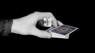 playing cards on human hand