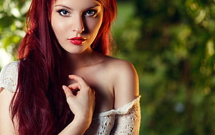 red haired woman wearing white dress
