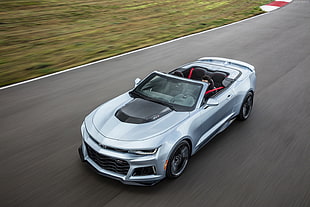 timelapse photography of silver Chevrolet Camaro convertible on concrete road