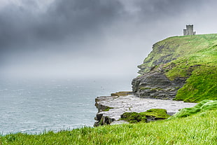 brown rock cliff near body of water, liscannor, ireland HD wallpaper