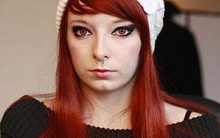 red haired woman with nose piercing
