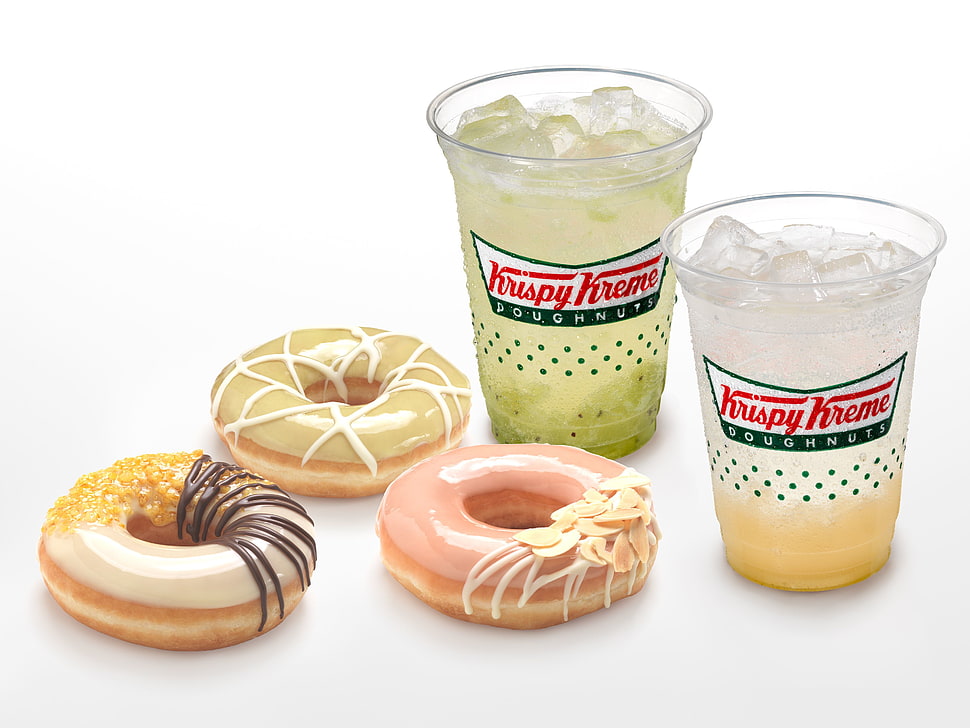 three assorted flavor of Kripy Kreme doughnuts and two drinks with white background HD wallpaper