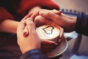 white ceramic cup, holding hands, coffee, couple