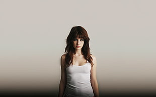 standing woman wearing white tank top HD wallpaper
