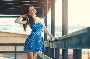 woman wearing blue and white tube dress