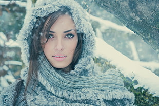 photo showing woman in gray scarf