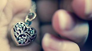 silver-colored heart pendant