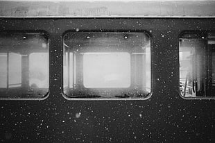 glass window with black frame, train station, train, snow flakes