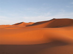 desert under white cloudy sky during daytime