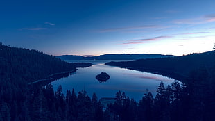 silhouette photo of lake during golden hour