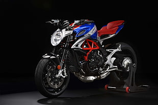 black, red, and gray sports bike with paddock stand HD wallpaper