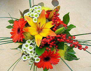 assorted flowers arrangement on brown surface
