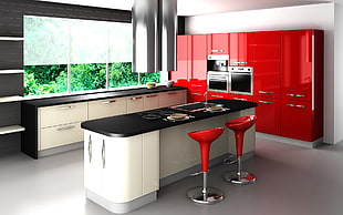 kitchen with white and black island and two red hydraulic stools HD wallpaper