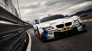 Shutter Speed photography of white BMW racing car